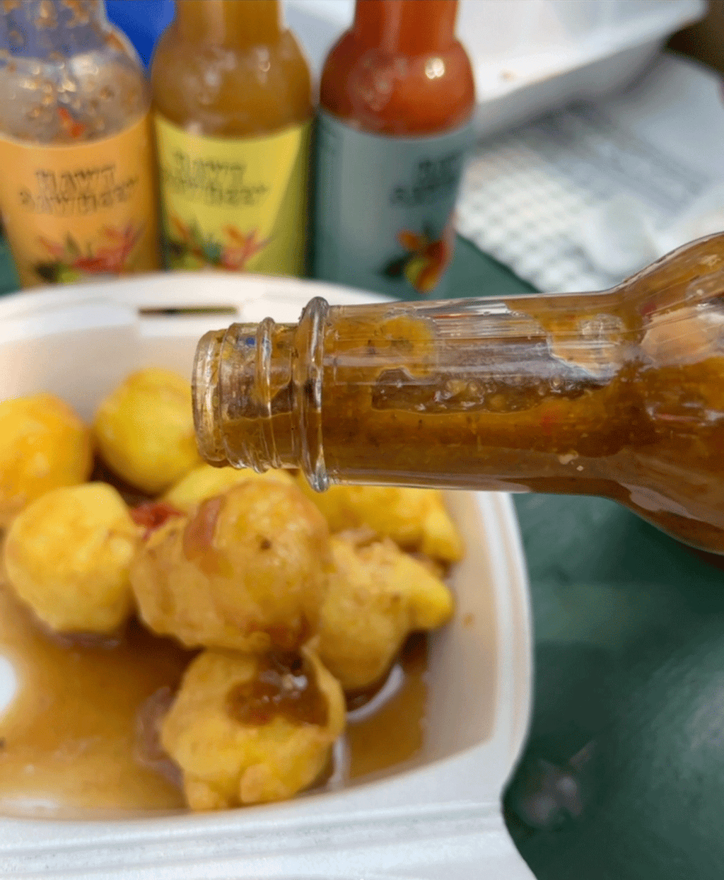 Plenty Peppa hot sauce served with pholourie